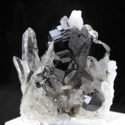 Cassiterite + Quartz + Arsenopyrite.