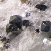 Blue Spinel in calcite with Mica