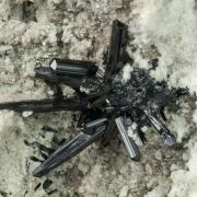 Tourmaline (Group) with Hematite (variety iron rose), Quartz and Feldspar