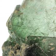 Fluorapatite with Actinolite (var: Byssolite) inclusions