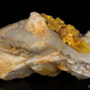 Wakabayashilite on Calcite