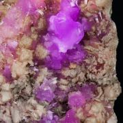 Talmessite coating Calcite and with Calcite (variety Co-bearing calcite)