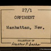 Wakabayashilite on Calcite