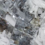 Fluorite with hydrocarbide inclusions, Baryte and Calcite