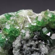 gem GARNET var. GROSSULAR with GREEN CHROMIAN PHANTOMS, CLINOCHLORE