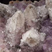 Calcite on Quartz (variety amethyst) and Hematite