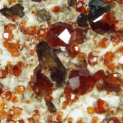 Garnet var. Spessartine and Quartz