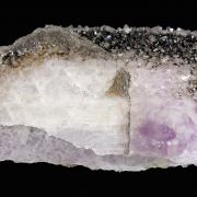 Quartz (variety amethyst) after Calcite with Hematite