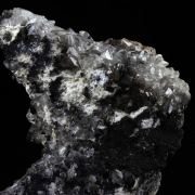 Calcite + Palygorskite + Romanechite.