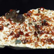 Garnet var. Spessartine and Quartz