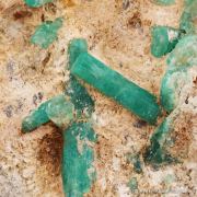 Beryl var. Emerald, on Calcite