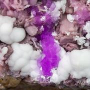 Talmessite coating Calcite and with Calcite (variety Co-bearing calcite)