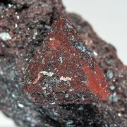 Zunyite with Hematite
