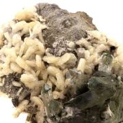 Quartz + Albite + Calcite.