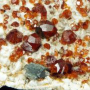 Garnet var. Spessartine and Quartz
