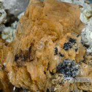 Roweite with Olshanskyite, Andradite and Calcite