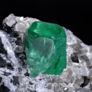 Beryl (variety emerald) on Calcite