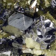 Pyrite pseudo. after pyrrhotite, siderite, galena, sphalerite