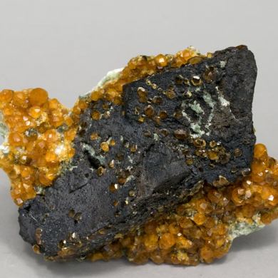 Manganese oxides after Helvine with Spessartine