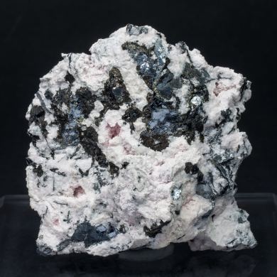 Nagyágite on Rhodochrosite