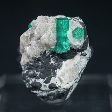 Beryl (variety emerald) on Calcite