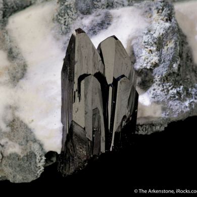 Neptunite on Natrolite